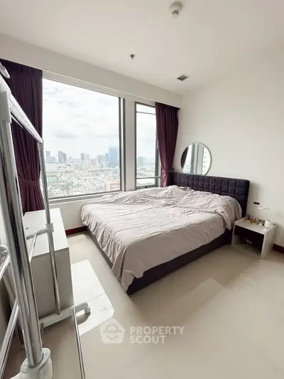 Spacious bedroom with stunning city view and modern furnishings