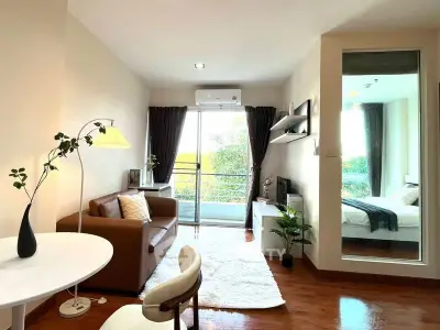 Modern living room with balcony and cozy bedroom view