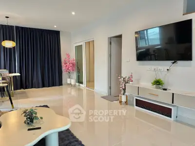 Modern living room with sleek TV setup and elegant decor