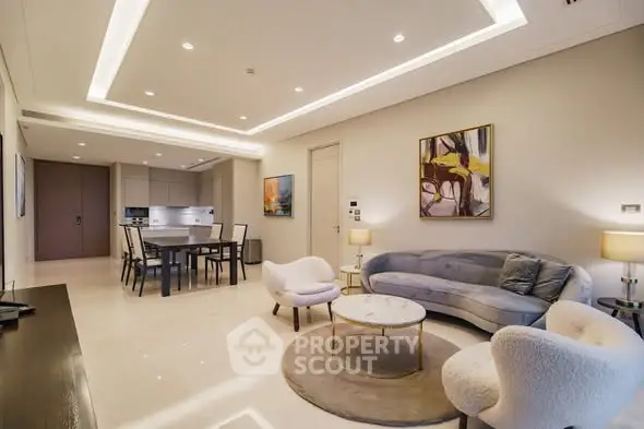 Luxurious modern living room with elegant furniture and open kitchen layout, perfect for stylish urban living.
