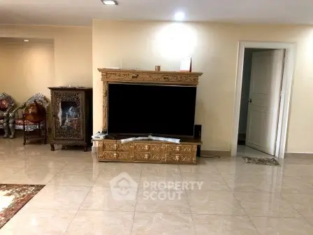 Spacious living room with elegant wooden TV cabinet and tiled flooring
