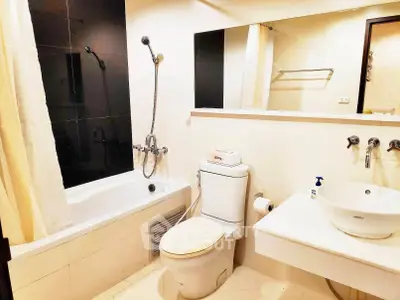 Modern bathroom with bathtub and sleek fixtures in a stylish apartment.