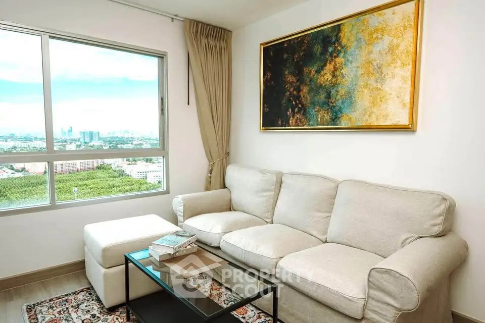 Stylish living room with a stunning city view, featuring a cozy sofa and modern decor.
