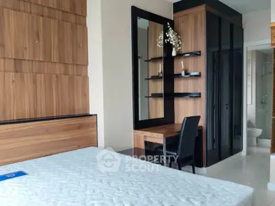 Modern bedroom with wooden accents and sleek furniture design