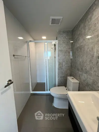 Modern bathroom with sleek design and spacious shower area