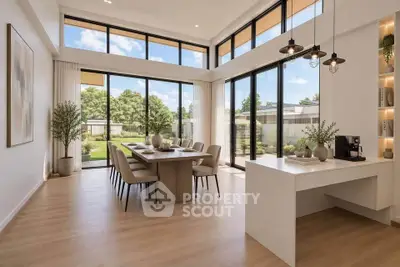 Stunning modern dining room with floor-to-ceiling windows and garden view