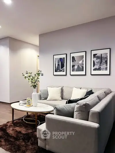 Elegant living room with modern decor and cozy seating area, perfect for relaxation and entertaining.