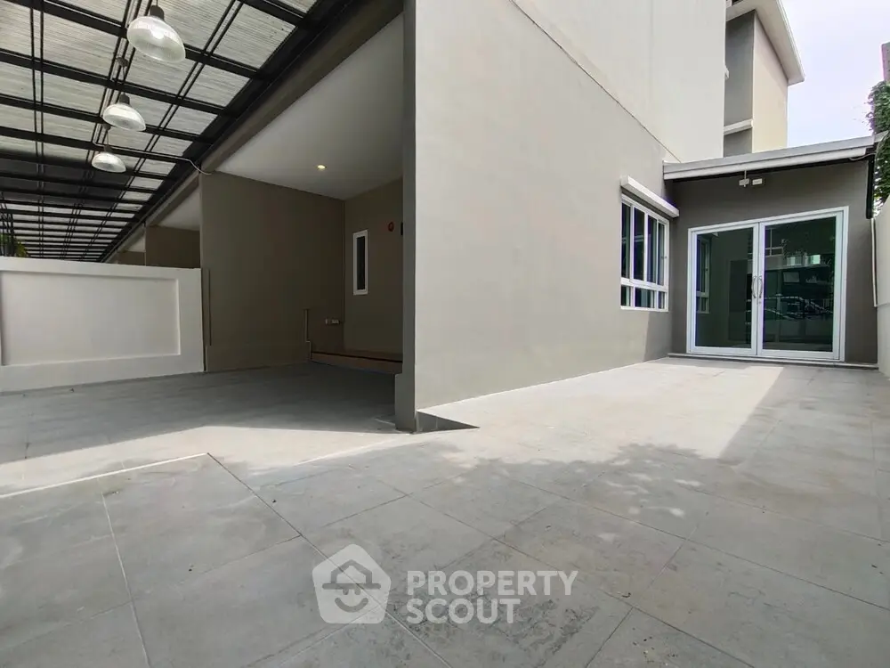 Spacious modern building exterior with sleek design and ample outdoor space.