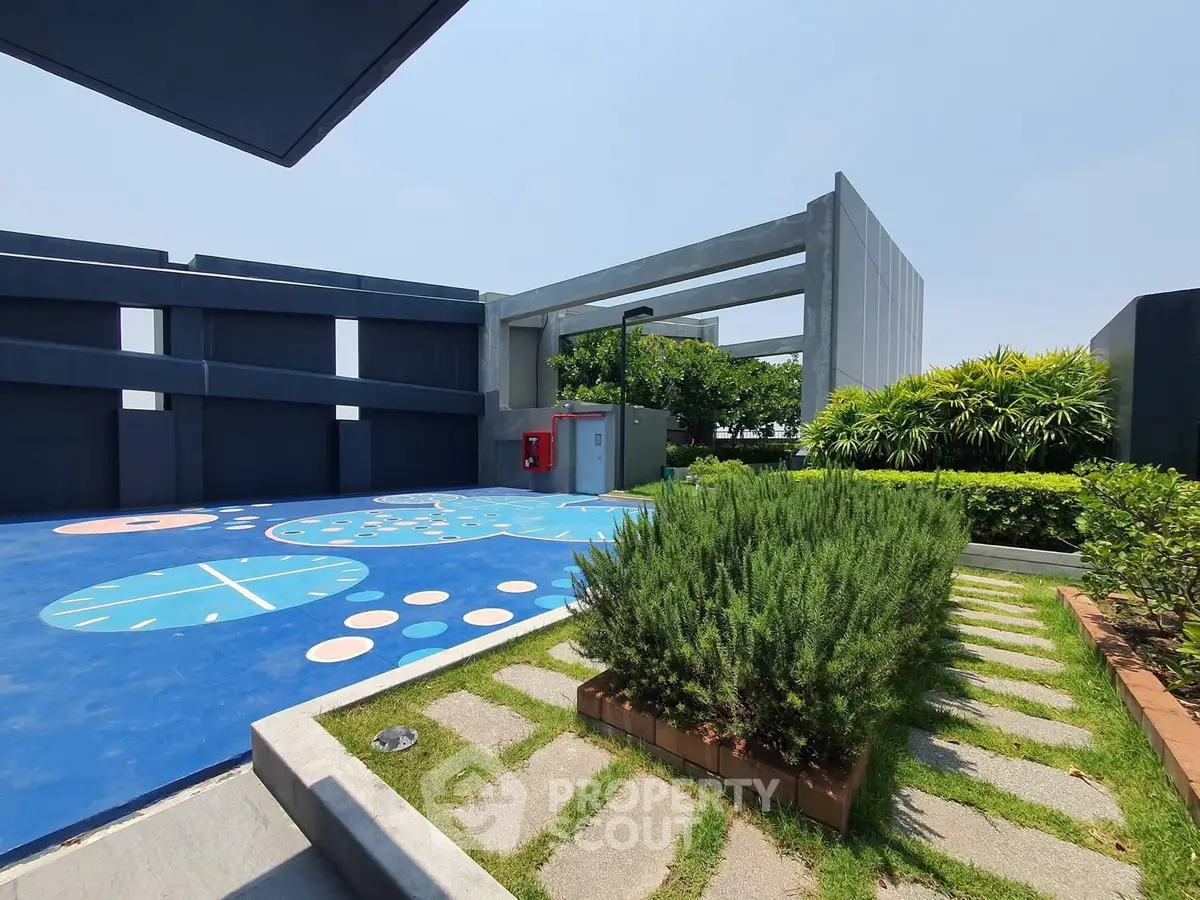 Modern rooftop garden with sports court and lush greenery