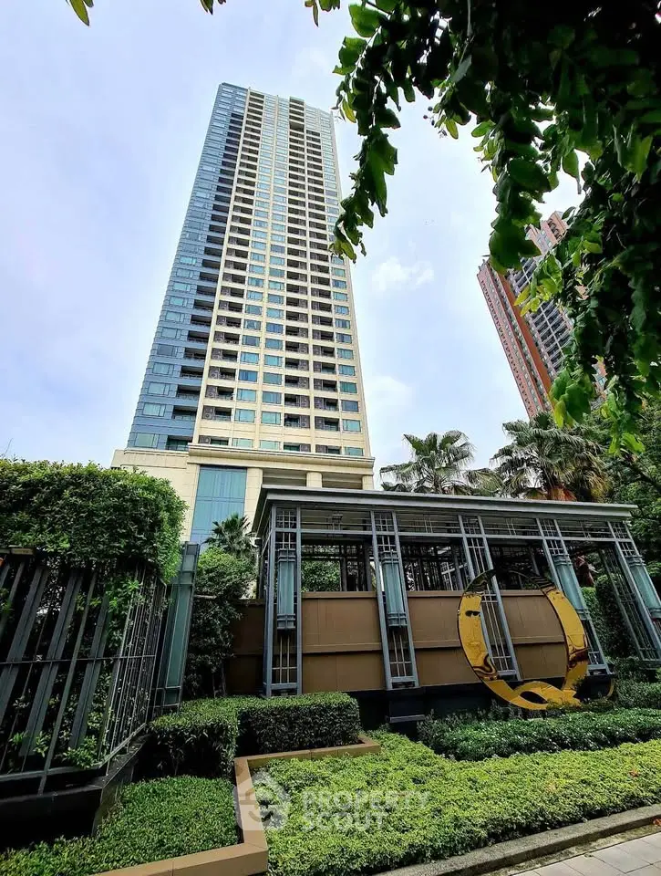 Stunning high-rise building with lush greenery and modern architecture in urban setting.