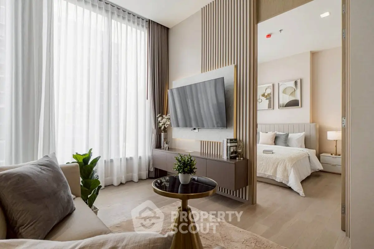 Luxurious modern living room with elegant decor and spacious bedroom view