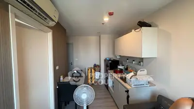 Cozy kitchen with modern appliances and dining area in compact apartment