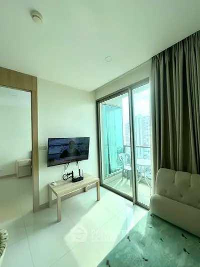 Bright living room with balcony view in modern apartment