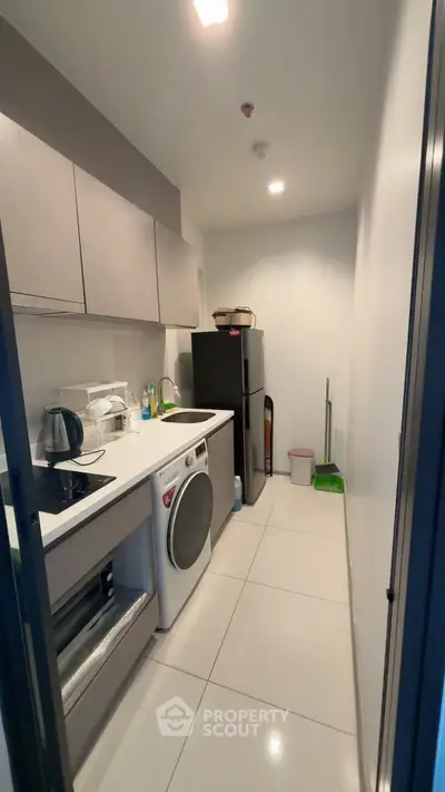 Modern kitchen with sleek appliances and ample storage space