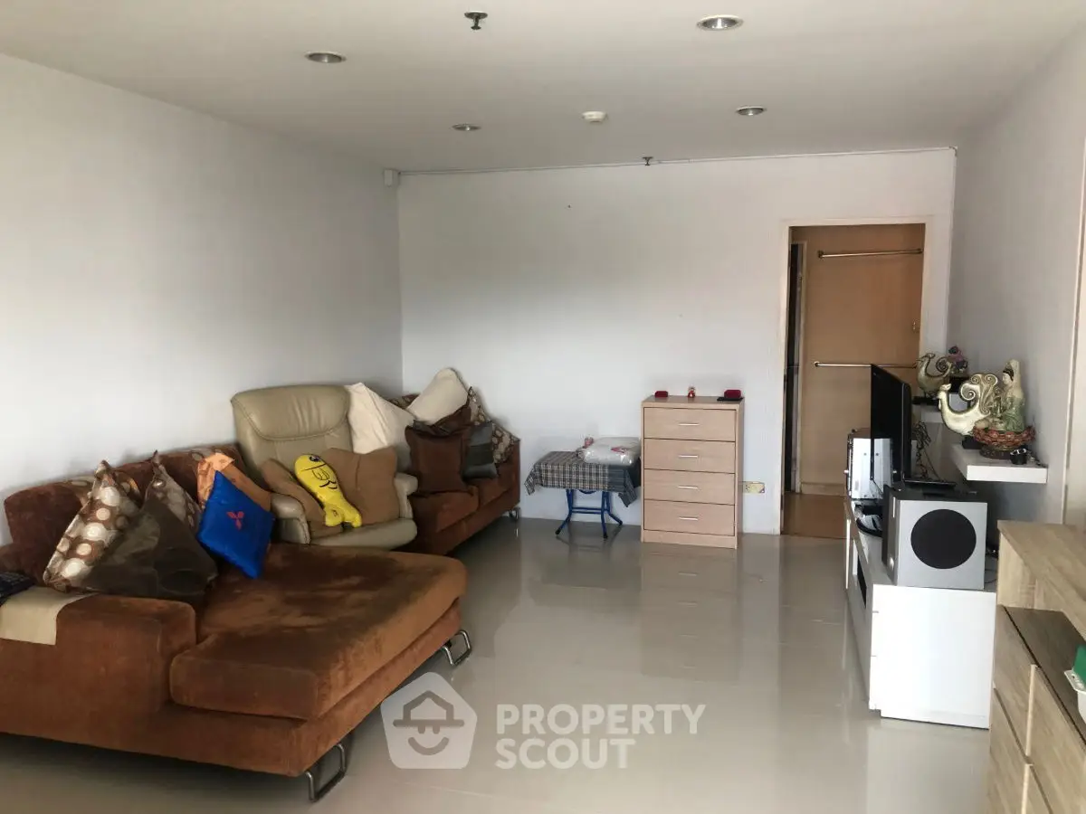 Spacious living room with modern furniture and neutral decor