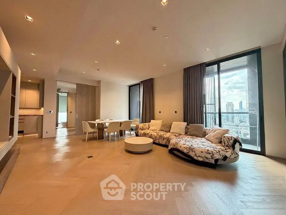 Spacious modern living room with city view and elegant furnishings