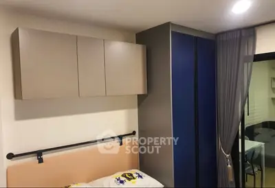 Modern bedroom with sleek storage and cozy decor