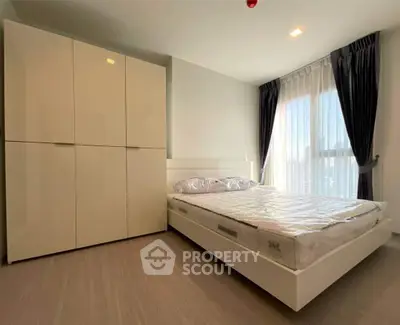 Modern bedroom with large wardrobe and natural light