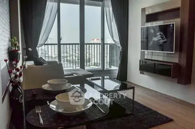 Modern living room with city view, sleek furniture, and wall-mounted TV in a high-rise apartment.