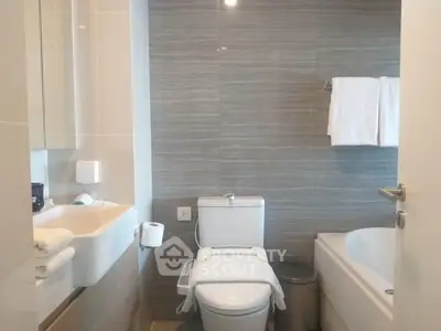 Modern bathroom with sleek fixtures and inviting bathtub