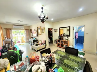 Spacious living room with dining area and balcony access