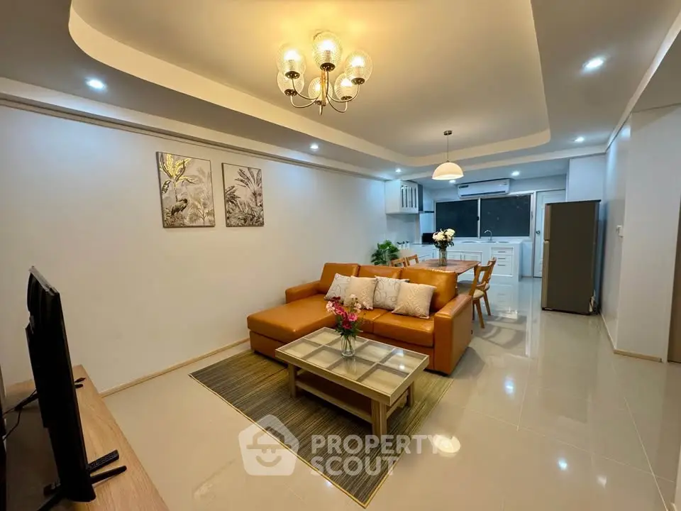 Spacious modern living room with open kitchen and elegant decor