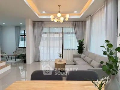 Spacious modern living room with elegant decor and large windows