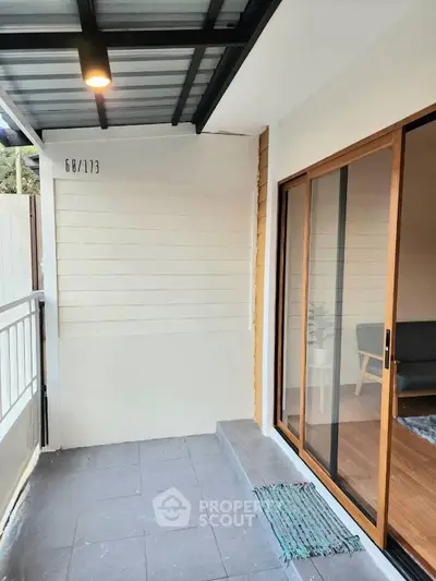 Charming balcony with sliding glass doors and modern design