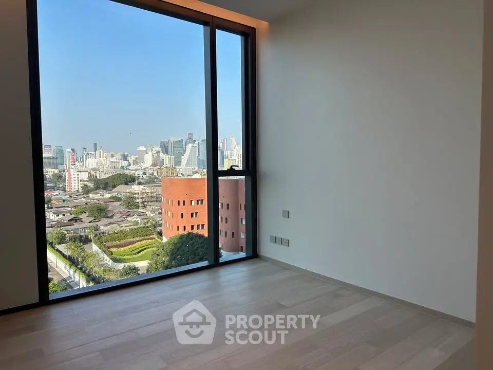 Spacious corner unit with floor-to-ceiling windows offering a stunning city view.