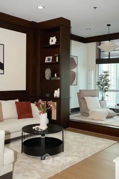 Luxurious living room with modern decor and city view, featuring elegant furniture and stylish shelving.
