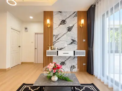 Modern living room with marble accent wall and elegant decor