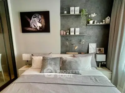 Modern bedroom with stylish decor and cozy bedding, featuring elegant wall art and shelving.