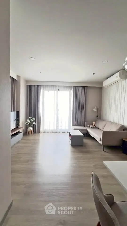 Spacious modern living room with natural light and stylish decor