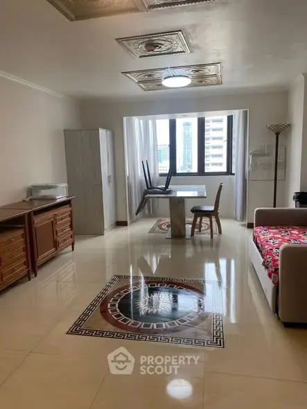 Spacious living room with elegant flooring and city view, featuring modern furniture and ample natural light.