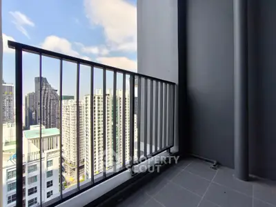 High-rise balcony with stunning cityscape view and modern railing design.