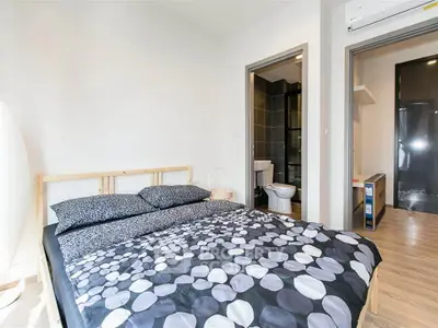 Modern bedroom with ensuite bathroom in stylish apartment
