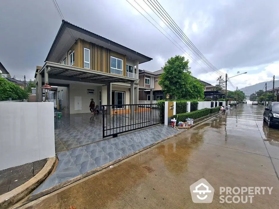 Modern two-story house with spacious driveway and sleek exterior design