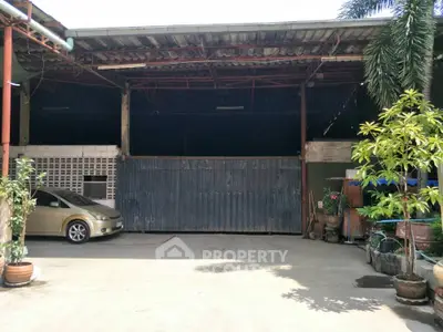 Spacious industrial warehouse with ample parking and greenery