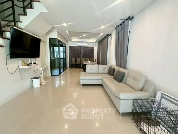 Spacious modern living room with sleek design and elegant furniture