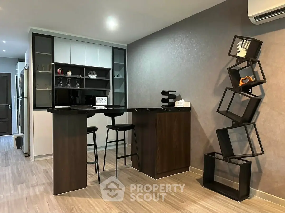 Modern kitchen with stylish bar counter and unique shelving unit
