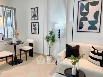 Stylish modern living room with chic decor and cozy seating area.