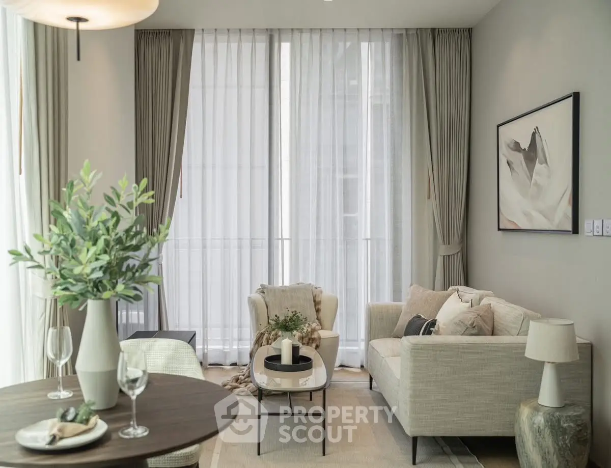 Elegant living room with modern decor and large windows