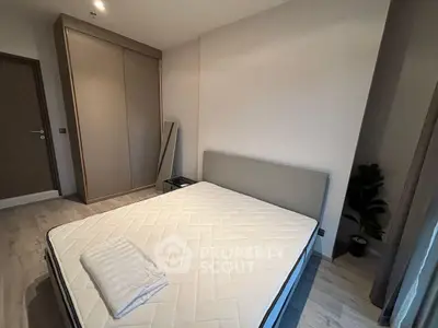 Modern bedroom with minimalist design and large wardrobe