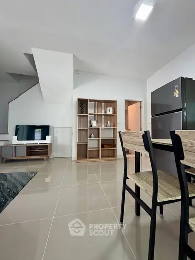 Modern open-plan living area with sleek furniture and stylish decor