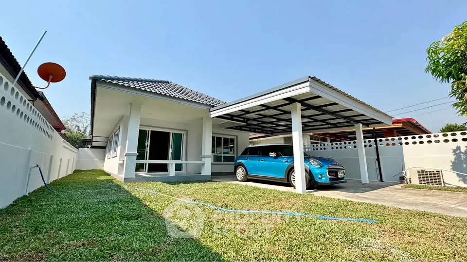 Charming single-story home with carport and lush green lawn, perfect for family living.