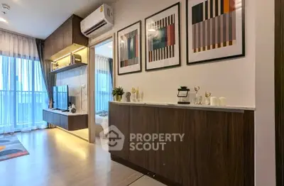 Modern living room with stylish decor and open view to bedroom