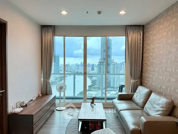Luxurious living room with stunning city view and modern furnishings in high-rise apartment.