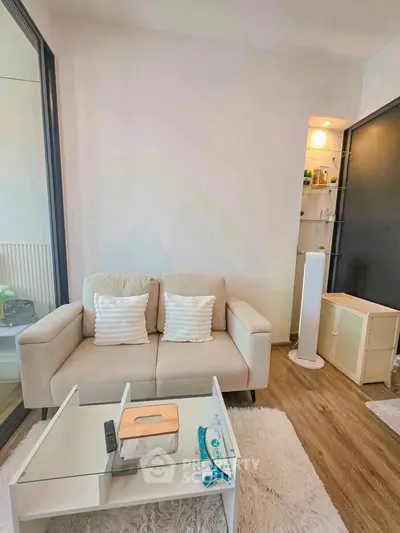 Chic modern living room with cozy sofa and stylish decor, perfect for urban living.
