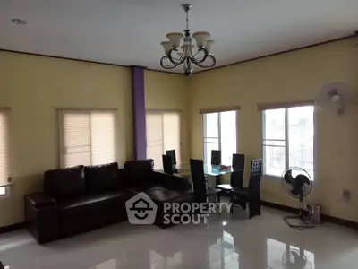 Spacious living room with modern furniture and large windows for natural light.