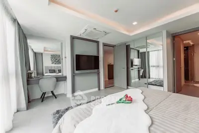 Luxurious modern bedroom with elegant decor and ample natural light